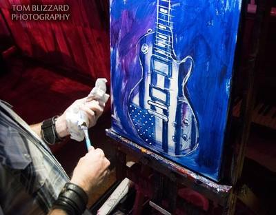 Roy Laws art, Painter of Music, live entertainment; live painting a guitar with US flag; Nashville, TN
